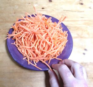 Pushing away a plate of unwanted carrots