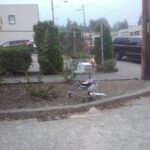 abandoned shopping cart being used as trash receptacle