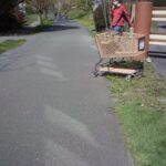 abandoned shopping cart left on bike path