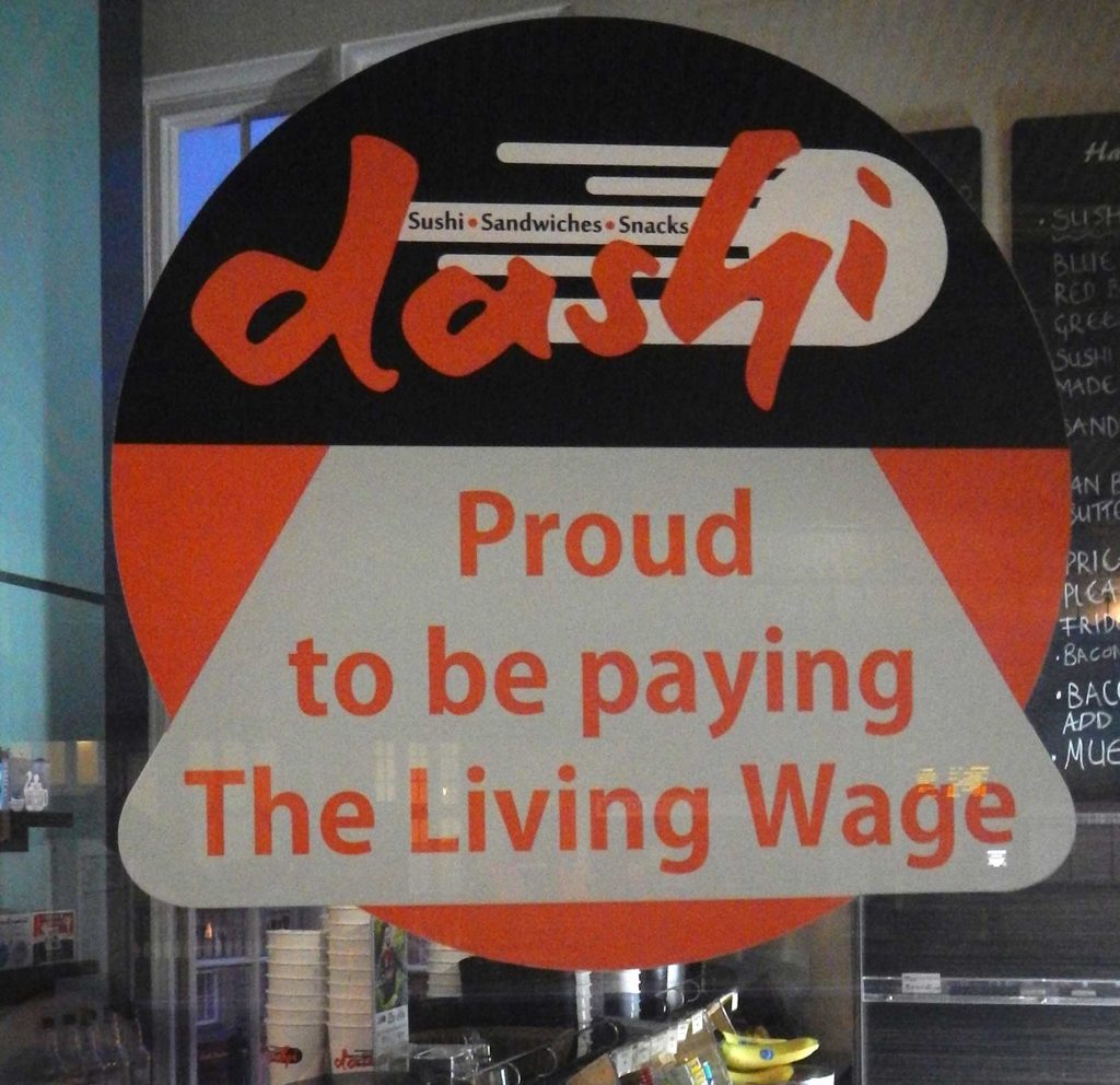 Image of Living Wage Sign in Dashi Sushi Coffee Shop Window - Bath England - better capitalism needed